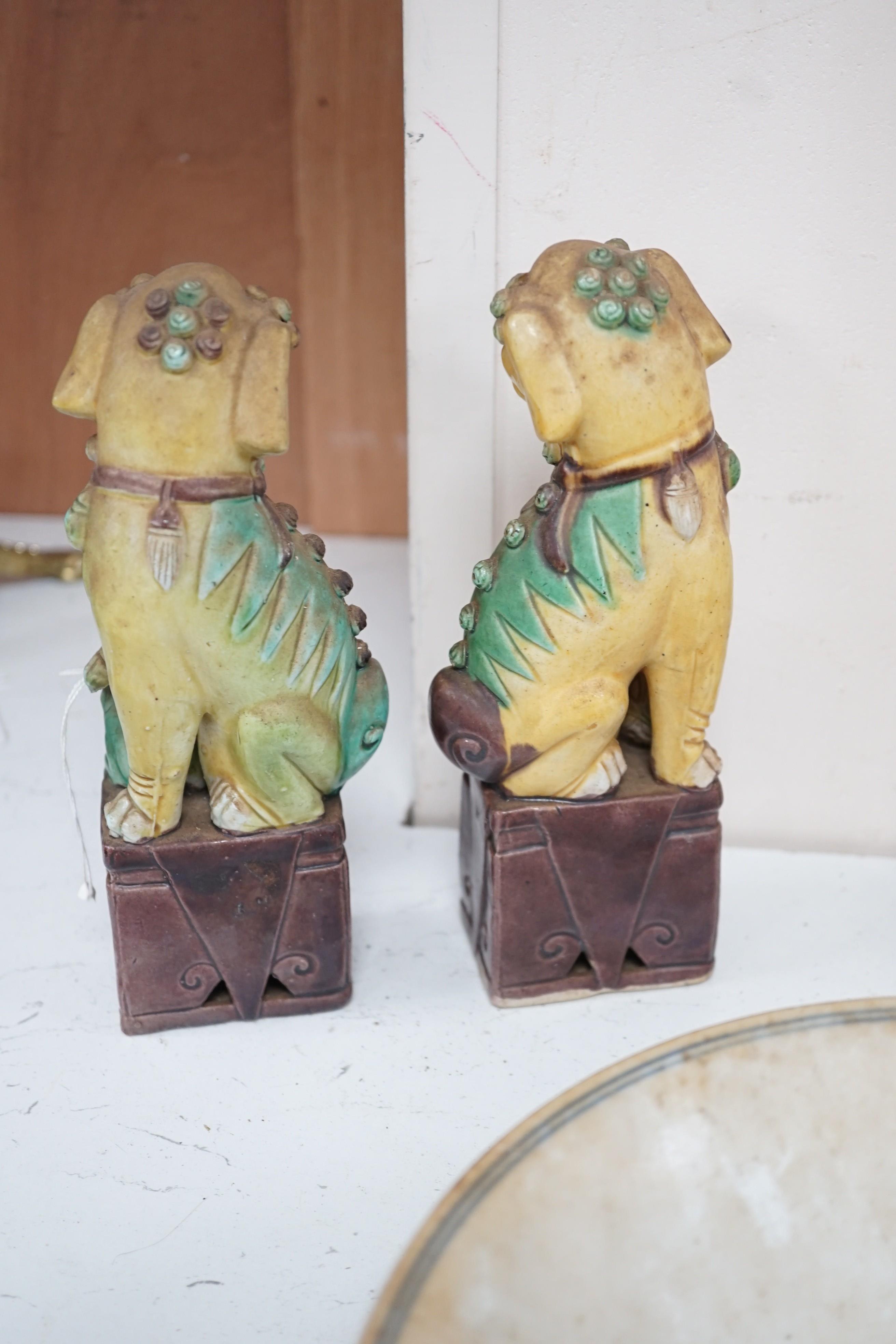 A pair of Chinese sancai lion dogs, together with a Chinese Republic period famille rose vase and bowl
